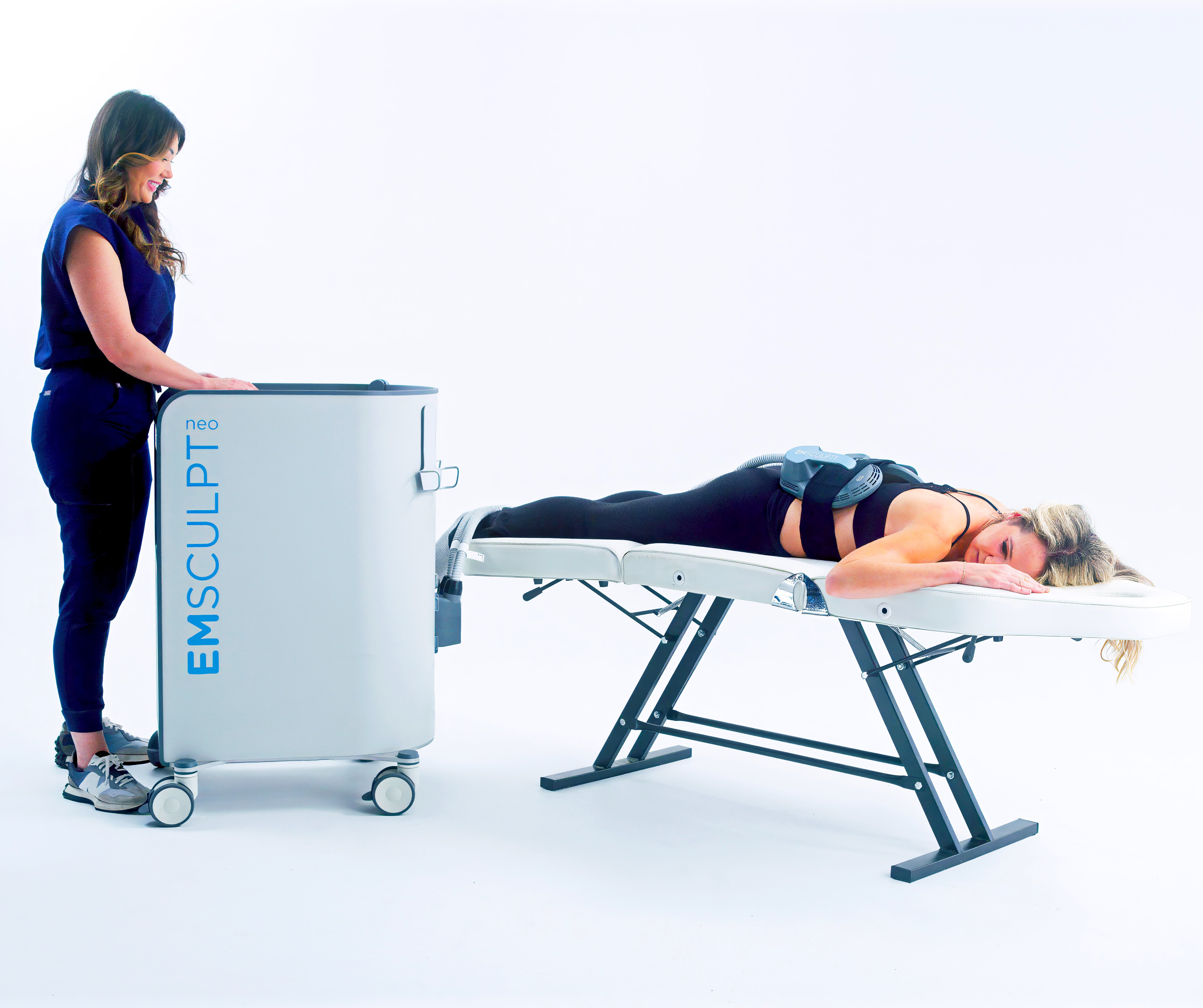 Emsculpt Neo female treatment on back with large applicator