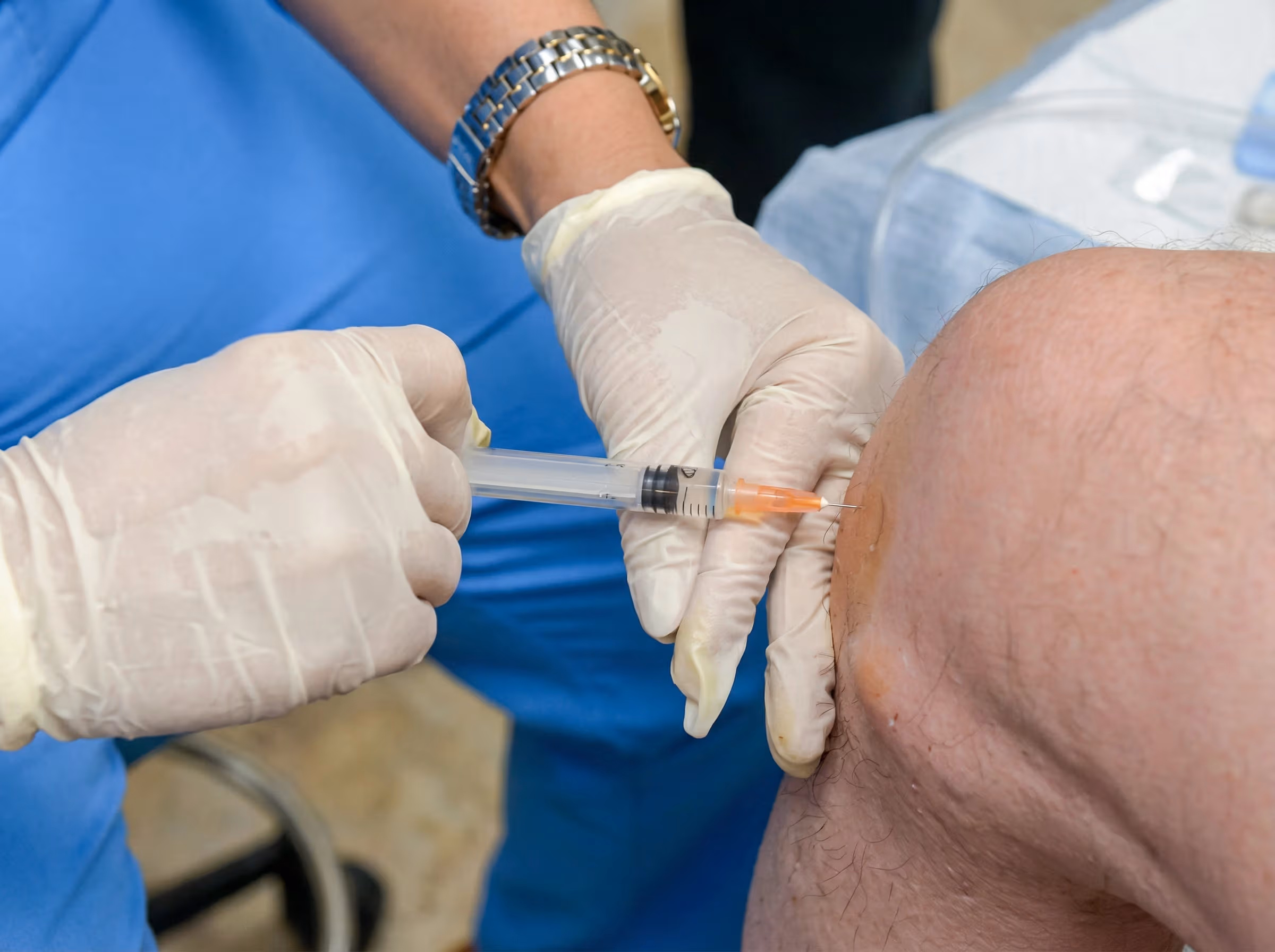 Close-up of PRP injection being administered by a gloved practitioner at NM Stem Cell